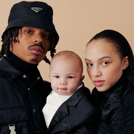 Joshua Omaru Marley took a picture with his baby and baby momma.